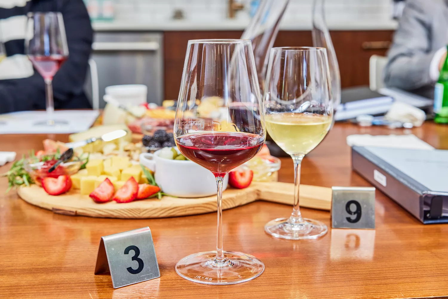 Richard Brendon x Jancis Robinson The Perfect Wine Glass glasses filled with red and white wines on wood table