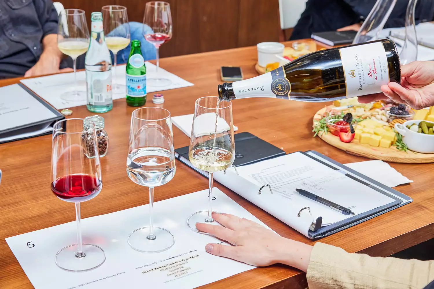 Zwiesel Glas Verbelle/Vervino Wine Glasses placed on table for testing by filled with colorful wines on each glass